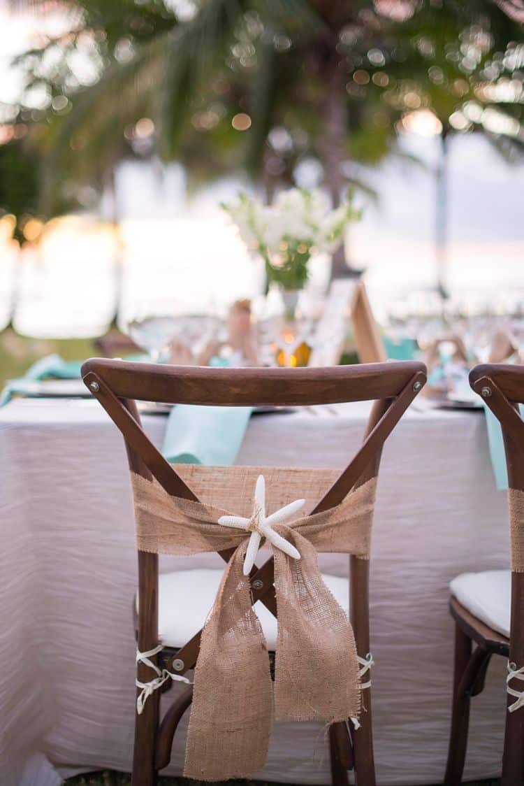 Unique beach wedding chair with burlap sash and starfish detail