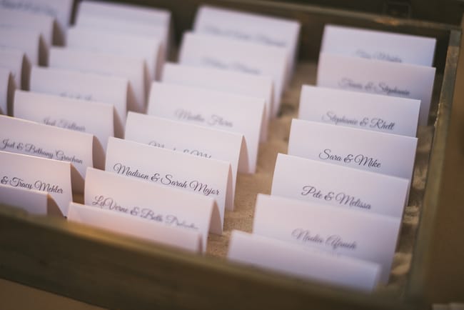 Destination Wedding seating cards in sand box