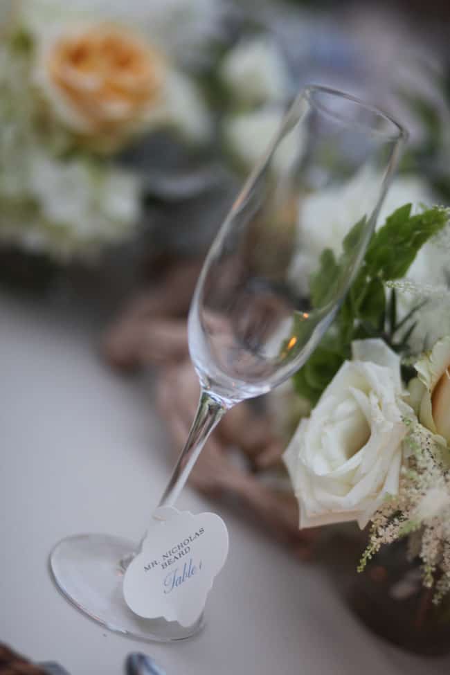 wedding seating cards on champagne glasses