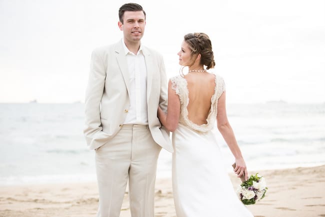 Gorgeous beach wedding dress back and neutral colored groom's suit