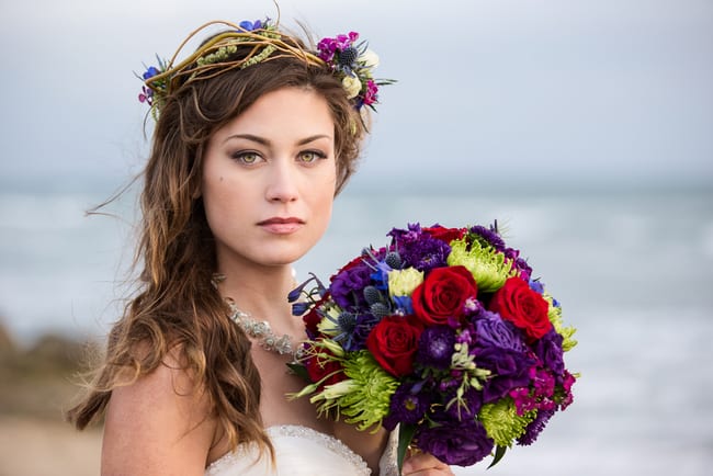 Jewel toned beach wedding bouquet and hair crown