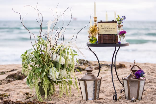 Gorgeous beach wedding inspiration with lanterns, treasure chests and jewel toned flowers