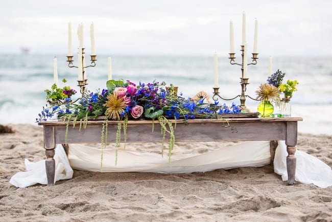 Gorgeous beach wedding inspiration with candelabras, treasure chests and jewel toned flowers