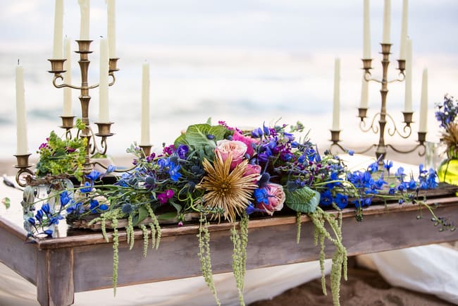 Stunning beach wedding centerpiece in jewel tones