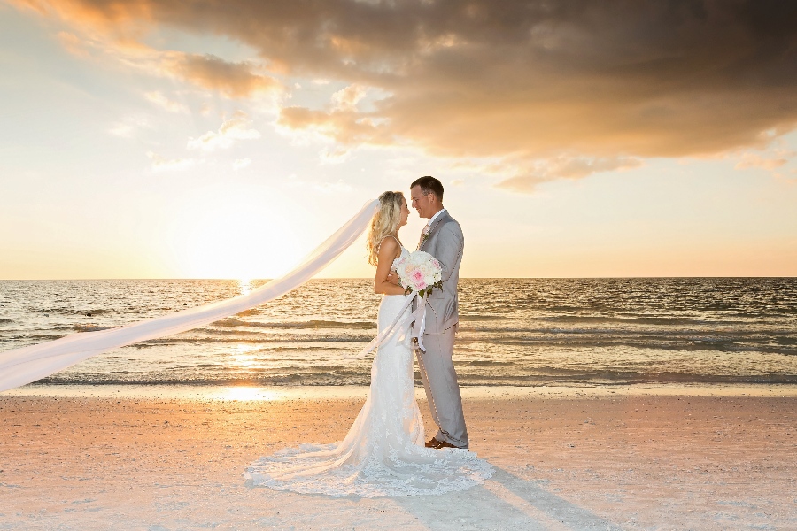 beach wedding veil blowing in the wind