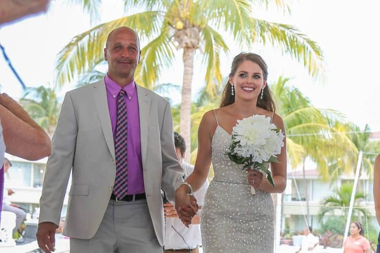 Father walking the bride down the aisle