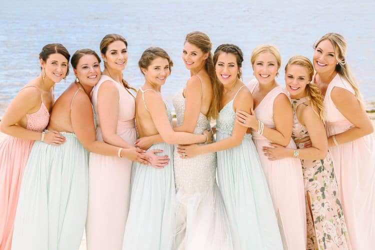 Beach wedding bridesmaids in pastel dresses