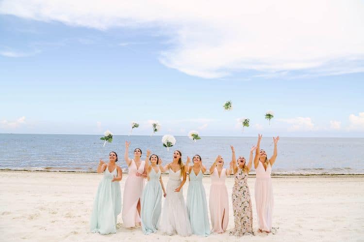 Beach wedding bridesmaids in pastel dresses