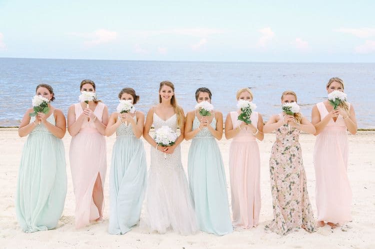 Beach wedding bridesmaids in pastel dresses