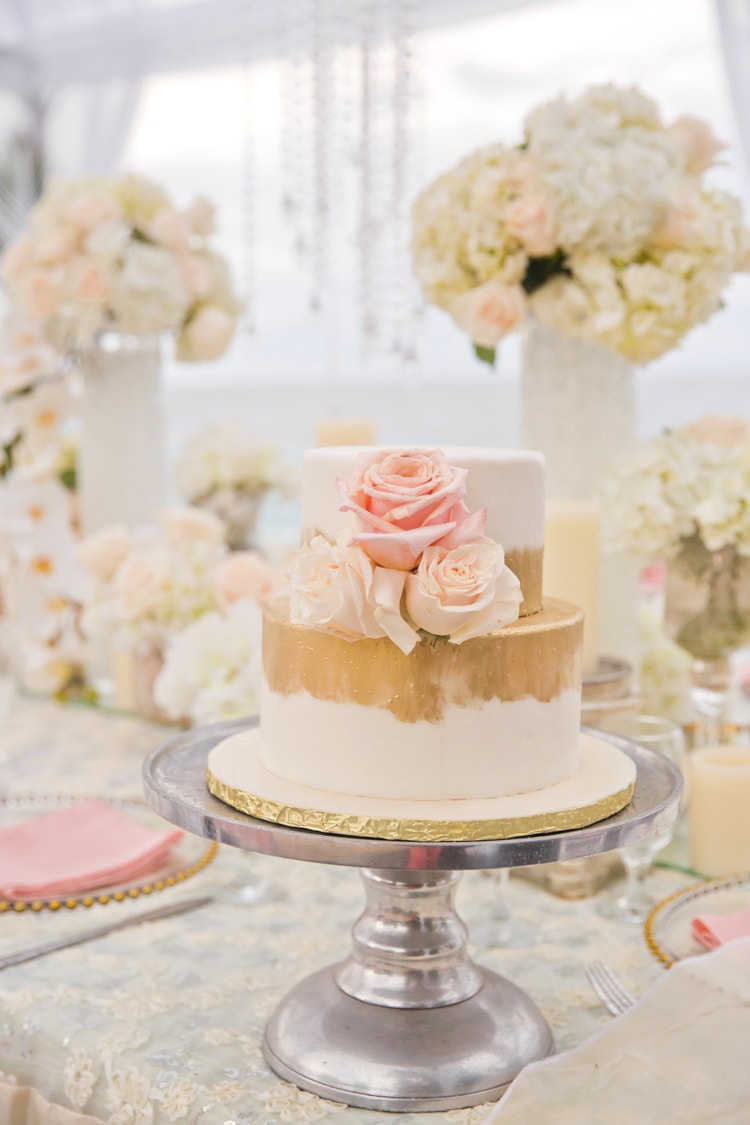 two tier gold and blush destination wedding cake
