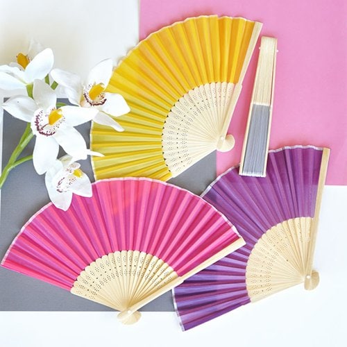 20 Wedding Welcome Bags and Favors Your Guests Will Love wedding fan favors